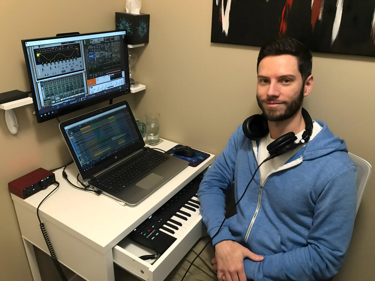 Studio shot Eric sat at his desk